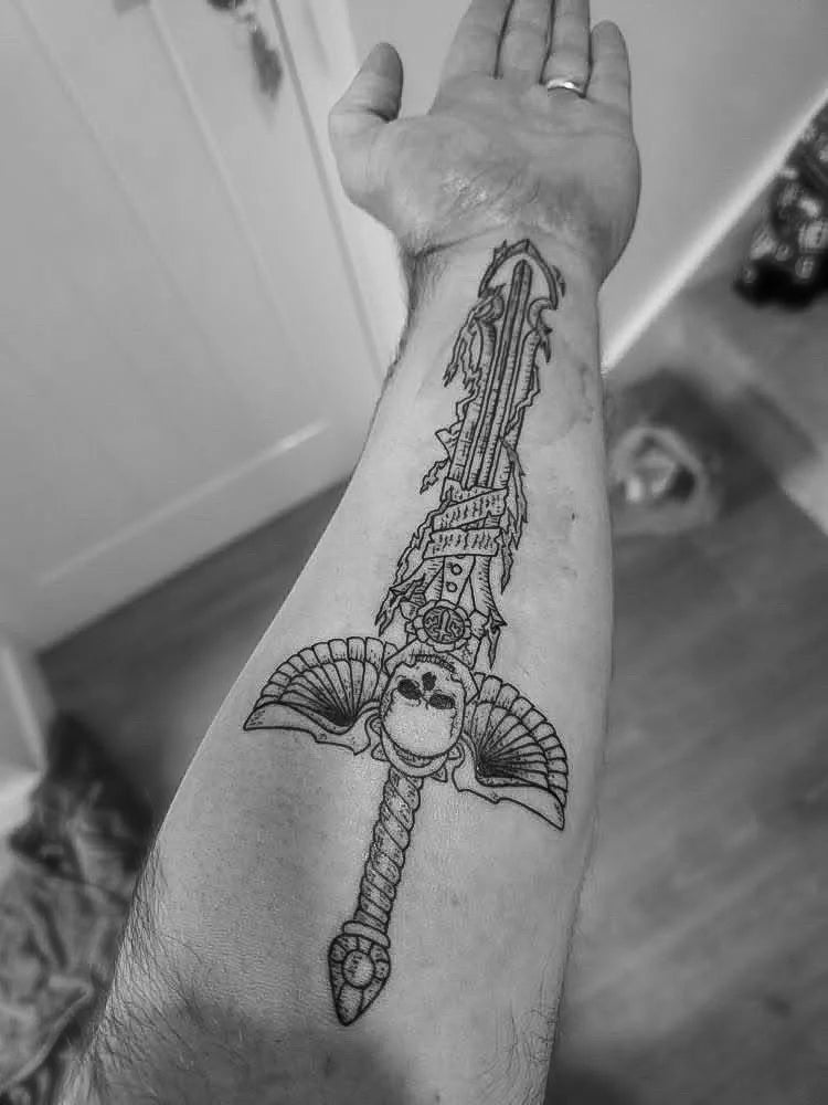 Detailed sword illustration tattoo